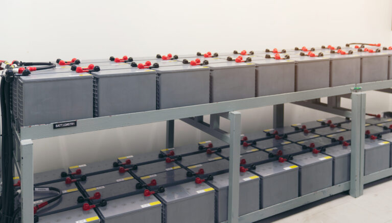 Battery pack in battery room in power plant for supply electricity in plant during shutdown phase, Rows of batteries in industrial backup power system.